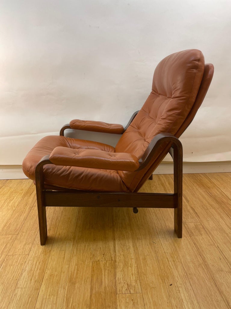 Pair of Swedish Modern Ergonomic Chairs with Matching Ottomen