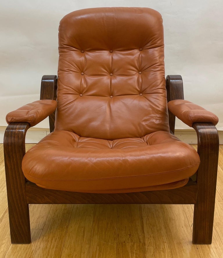 Pair of Swedish Modern Ergonomic Chairs with Matching Ottomen