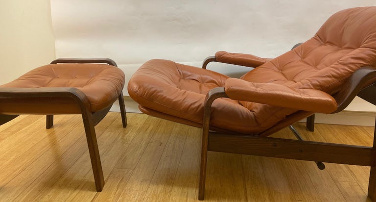 Pair of Swedish Modern Ergonomic Chairs with Matching Ottomen