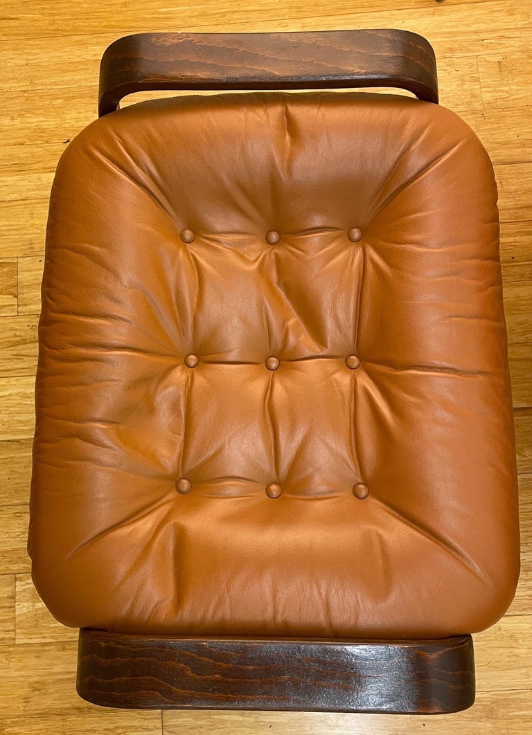 Pair of Swedish Modern Ergonomic Chairs with Matching Ottomen