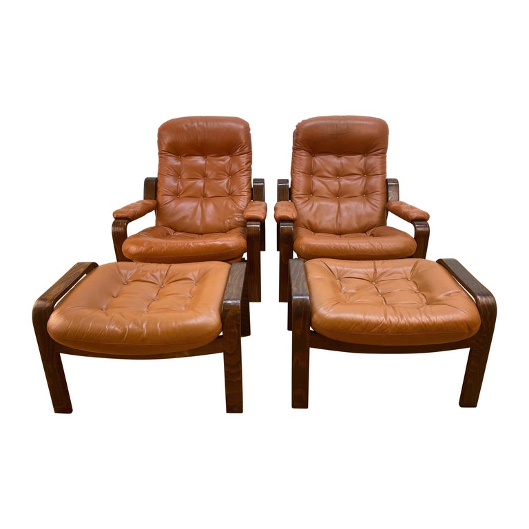 Pair of Swedish Modern Ergonomic Chairs with Matching Ottomen